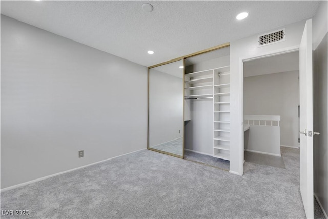4680 Freshwater Dr, Las Vegas, NV 89103 - unfurnished bedroom with visible vents, baseboards, recessed lighting, a textured ceiling, and carpet flooring