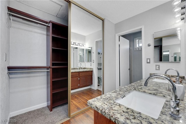 4680 Freshwater Dr, Las Vegas, NV 89103 - bathroom with vanity, baseboards, and wood finished floors