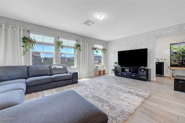 96 Campbelltown Ave, Henderson, NV 89015 - living room featuring visible vents, a healthy amount of sunlight, and wood finished floors
