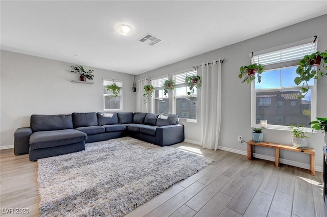 96 Campbelltown Ave, Henderson, NV 89015 - living area with baseboards, light wood-type flooring, and visible vents