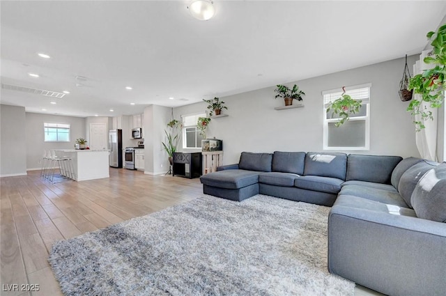 96 Campbelltown Ave, Henderson, NV 89015 - living area with light wood-style floors, baseboards, recessed lighting, and visible vents