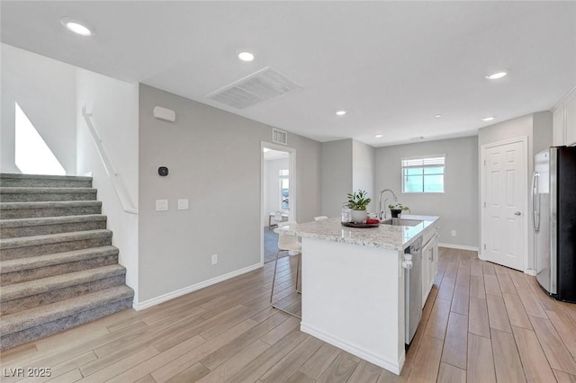 96 Campbelltown Ave, Henderson, NV 89015 - kitchen with visible vents, a sink, white cabinetry, and appliances with stainless steel finishes