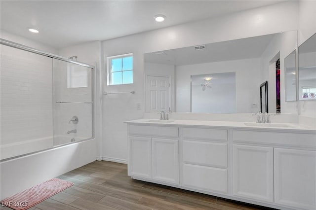 96 Campbelltown Ave, Henderson, NV 89015 - bathroom featuring a sink, enclosed tub / shower combo, double vanity, and visible vents