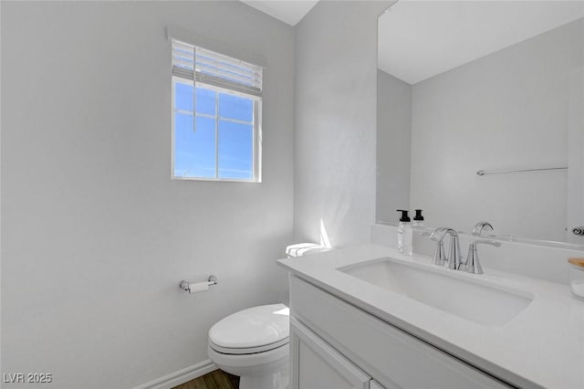 96 Campbelltown Ave, Henderson, NV 89015 - bathroom featuring vanity, baseboards, toilet, and wood finished floors
