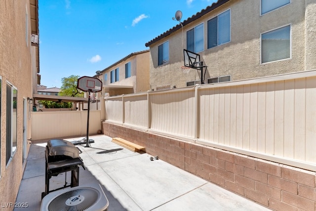 view of patio featuring a fenced backyard and cooling unit
