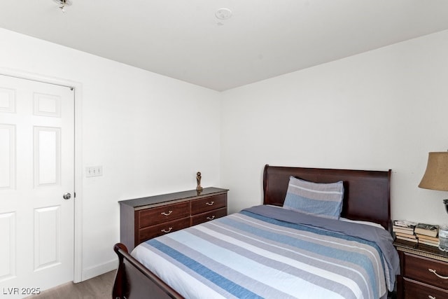 bedroom featuring light wood finished floors