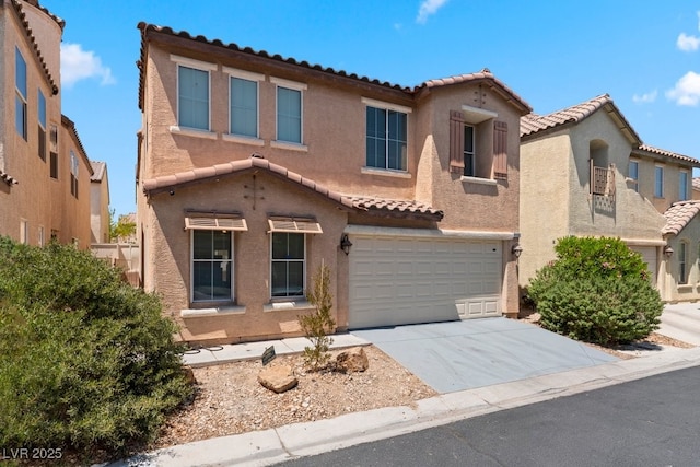 view of front of house with a tiled roof, stucco siding, concrete driveway, and a garage
