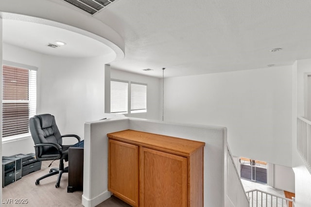 home office with visible vents and light wood-style flooring