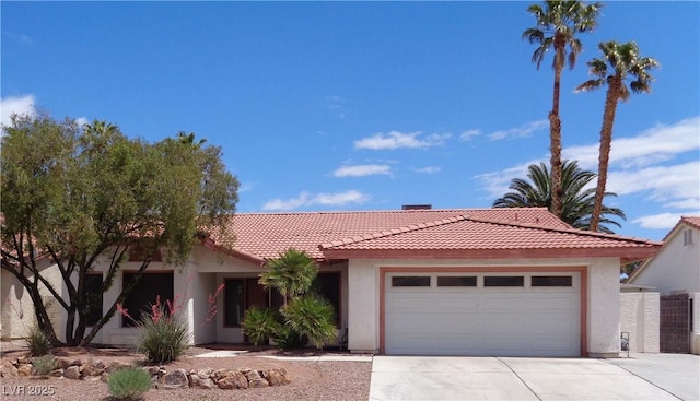 single story home with an attached garage, stucco siding, concrete driveway, and a tiled roof
