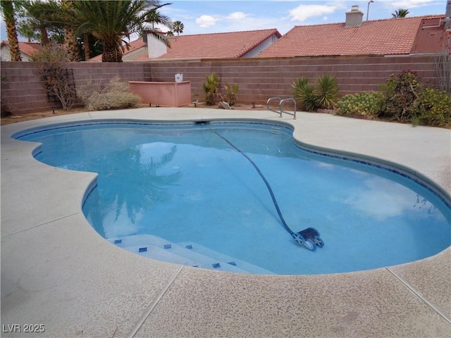 view of pool with a fenced in pool, a fenced backyard, and a patio