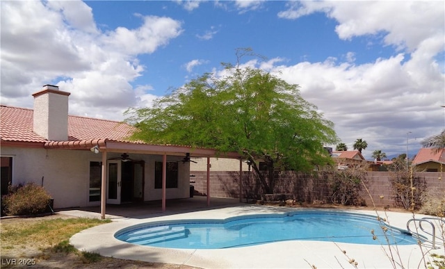 view of pool with a fenced backyard, a fenced in pool, a patio, and ceiling fan
