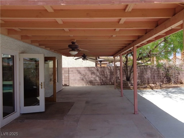 view of patio featuring fence and ceiling fan