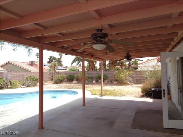 view of swimming pool with a fenced in pool, a fenced backyard, a ceiling fan, and a patio area