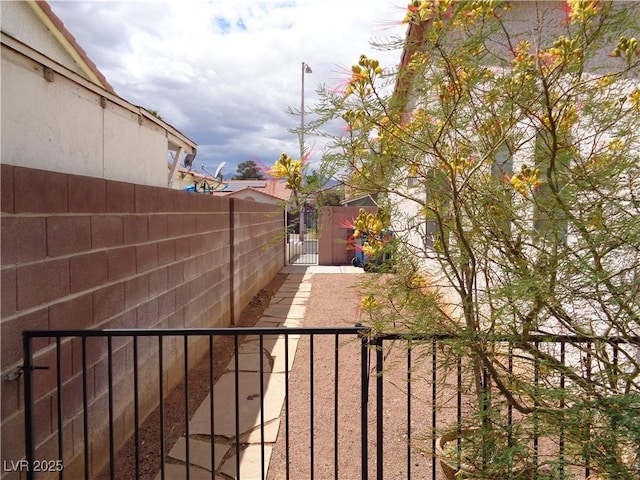 view of yard featuring a gate and fence
