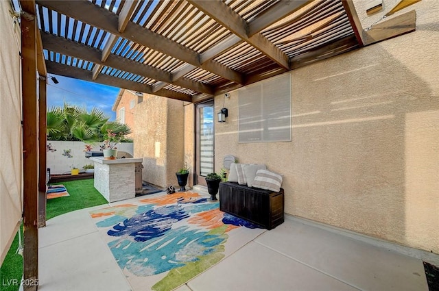 view of patio with fence and a pergola