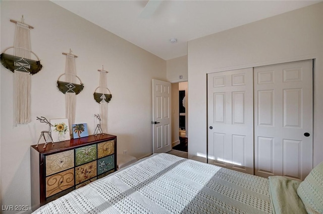 bedroom with ceiling fan and a closet