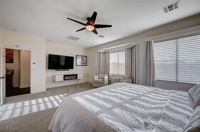 bedroom with baseboards, carpet flooring, and visible vents