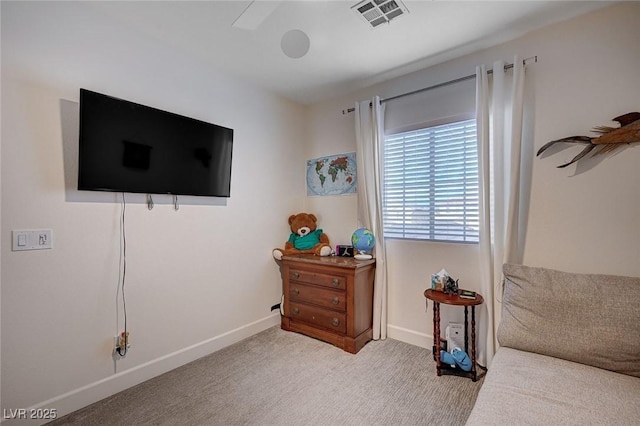 sitting room with visible vents, baseboards, and carpet floors