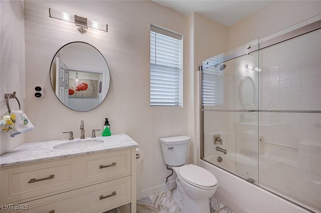 full bath featuring vanity, marble finish floor, toilet, baseboards, and enclosed tub / shower combo