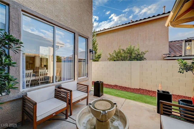 view of patio / terrace with fence