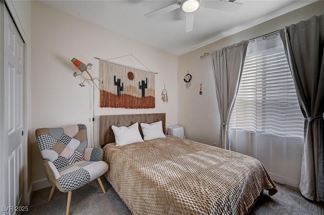 bedroom featuring a closet, baseboards, carpet, and a ceiling fan