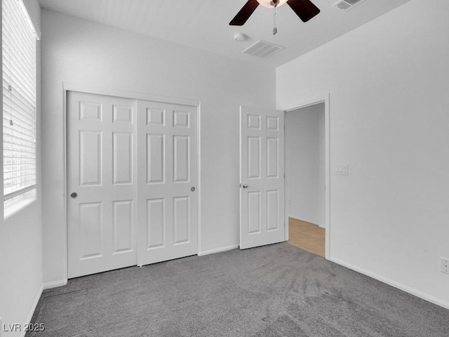 1063 Upper Springs St, Henderson, NV 89002 - unfurnished bedroom featuring carpet flooring, a closet, a ceiling fan, and baseboards
