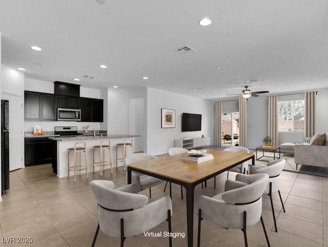 1063 Upper Springs St, Henderson, NV 89002 - dining area with light tile patterned floors, recessed lighting, and ceiling fan