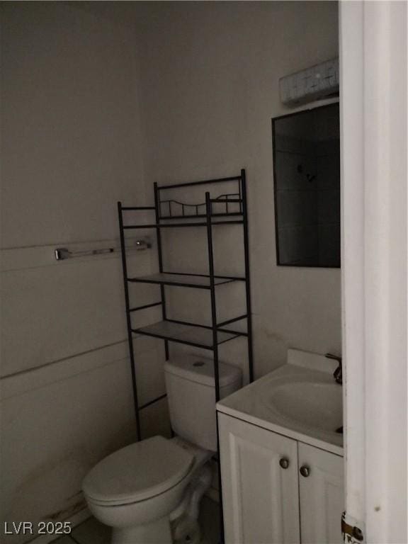 bathroom with toilet and vanity