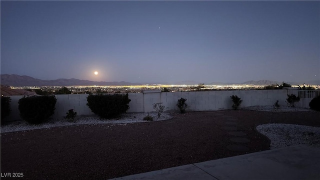 property view of water with a fenced backyard