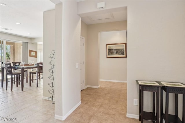 8316 Imperial Lakes St, Las Vegas, NV 89131 - corridor with light tile patterned flooring, attic access, and baseboards