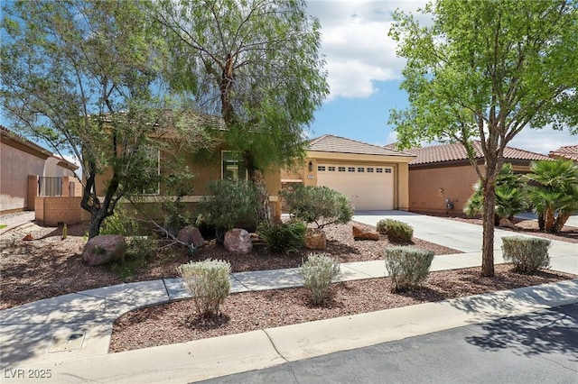 8316 Imperial Lakes St, Las Vegas, NV 89131 - view of front facade featuring concrete driveway, a garage, a tile roof, and stucco siding
