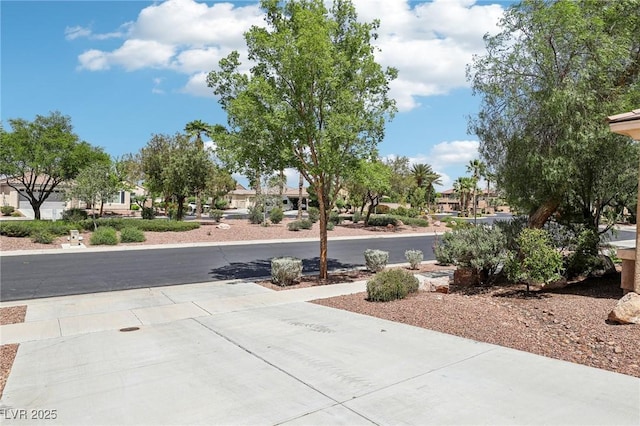 8316 Imperial Lakes St, Las Vegas, NV 89131 - view of concrete driveway with a residential view