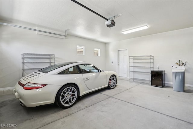 8316 Imperial Lakes St, Las Vegas, NV 89131 - garage with a garage door opener and baseboards