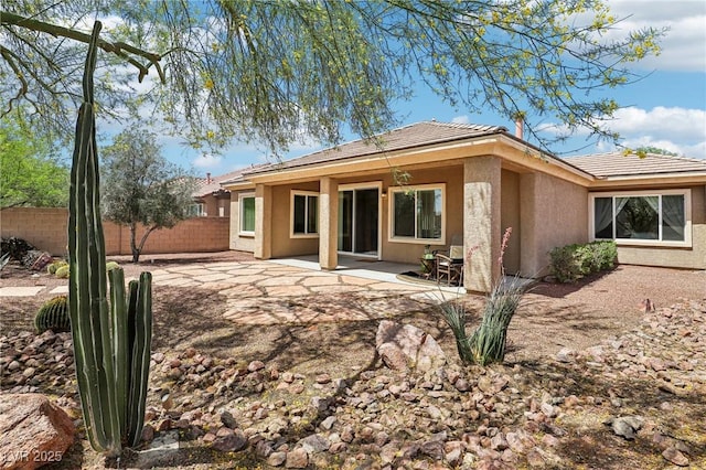 8316 Imperial Lakes St, Las Vegas, NV 89131 - rear view of property featuring stucco siding, a patio, and a tile roof