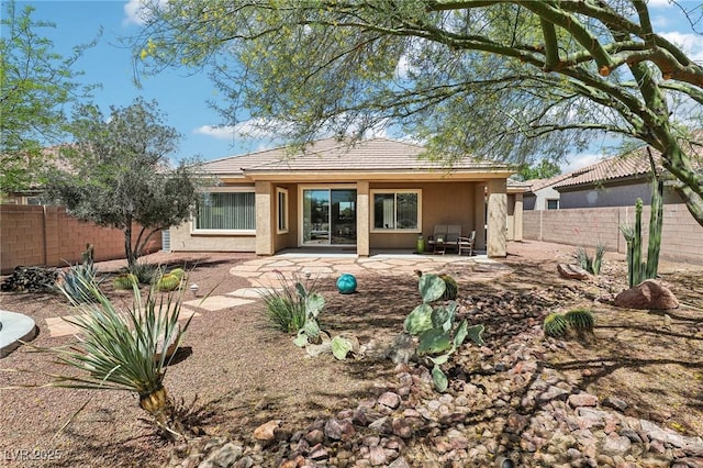 8316 Imperial Lakes St, Las Vegas, NV 89131 - rear view of house with a fenced backyard, a patio, and stucco siding