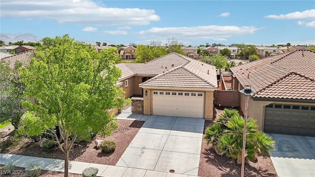 8316 Imperial Lakes St, Las Vegas, NV 89131 - view of front of home featuring stucco siding, driveway, a tile roof, and a residential view