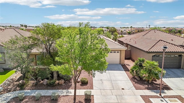 8316 Imperial Lakes St, Las Vegas, NV 89131 - view of front of property featuring a tiled roof, stucco siding, a residential view, driveway, and a garage