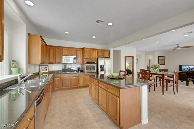 8316 Imperial Lakes St, Las Vegas, NV 89131 - kitchen with appliances with stainless steel finishes, a sink, light tile patterned floors, ceiling fan, and recessed lighting