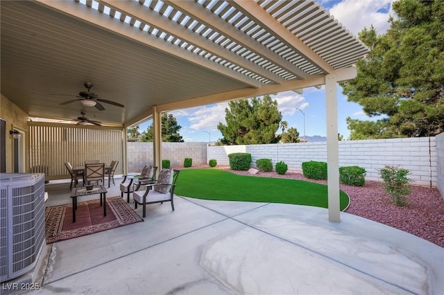 view of patio / terrace featuring a fenced backyard, ceiling fan, and cooling unit