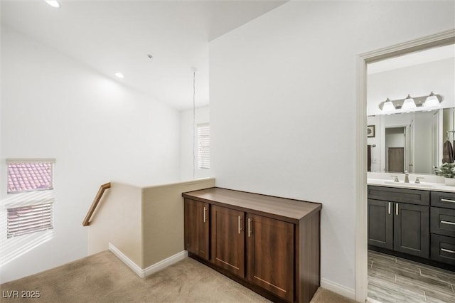 bathroom with baseboards and vanity