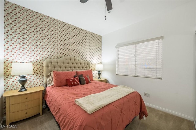 carpeted bedroom featuring baseboards and a ceiling fan