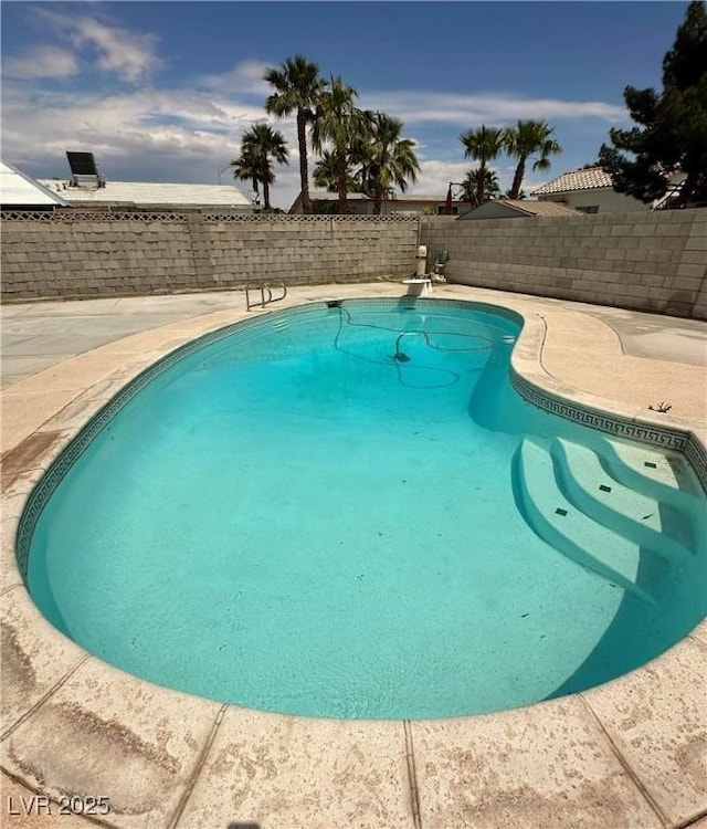 view of swimming pool featuring a fenced in pool, a patio, and a fenced backyard