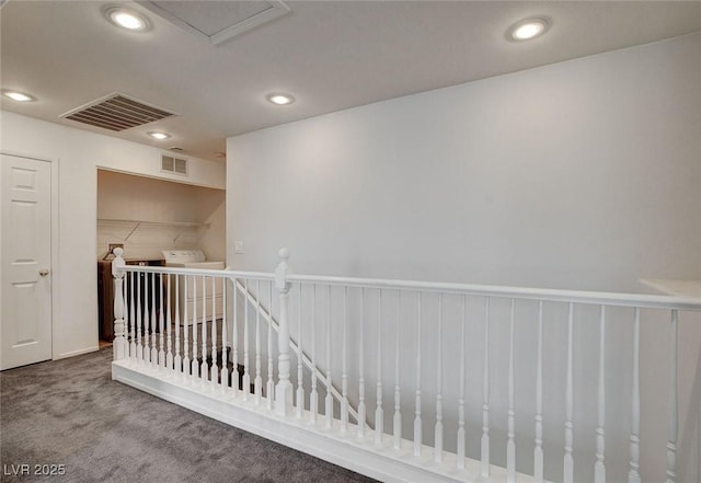 hallway with visible vents, recessed lighting, carpet, and an upstairs landing