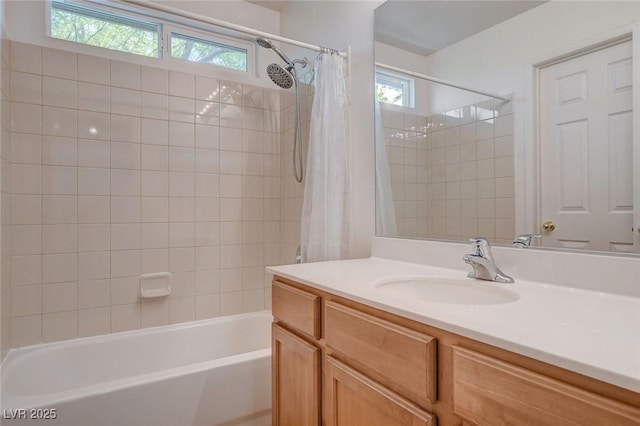 bathroom with vanity, plenty of natural light, and shower / bath combo with shower curtain