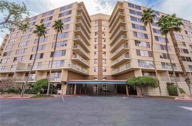 205 E Harmon Ave Unit 409, Las Vegas, NV 89169 - view of property with uncovered parking