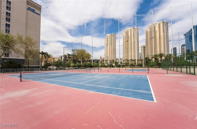 205 E Harmon Ave Unit 409, Las Vegas, NV 89169 - view of sport court with a view of city, fence, and community basketball court