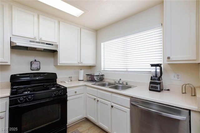 kitchen with a sink, white cabinetry, black range with gas cooktop, under cabinet range hood, and dishwasher
