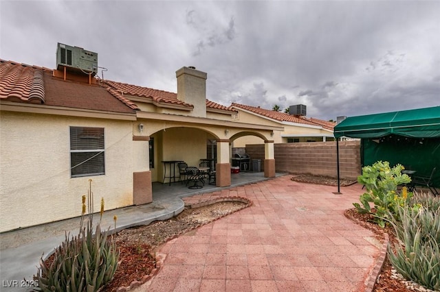 2595 Fort Lauderdale Dr, Las Vegas, NV 89156 - view of patio / terrace with fence, central AC unit, and a grill