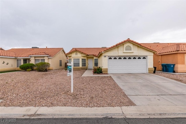 2595 Fort Lauderdale Dr, Las Vegas, NV 89156 - mediterranean / spanish-style house featuring stucco siding, concrete driveway, a garage, and a tiled roof