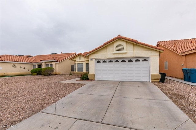 2595 Fort Lauderdale Dr, Las Vegas, NV 89156 - view of front of home with driveway, an attached garage, stucco siding, and a tile roof
